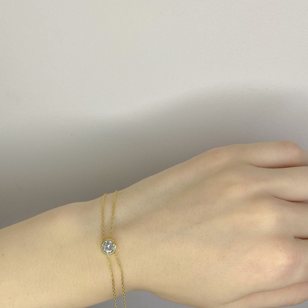 Sidabrinė auksuota apyrankė su cirkonio akute