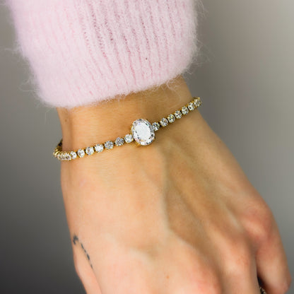 Auksuota apyrankė Tennis su ovaliu baltu cirkoniu