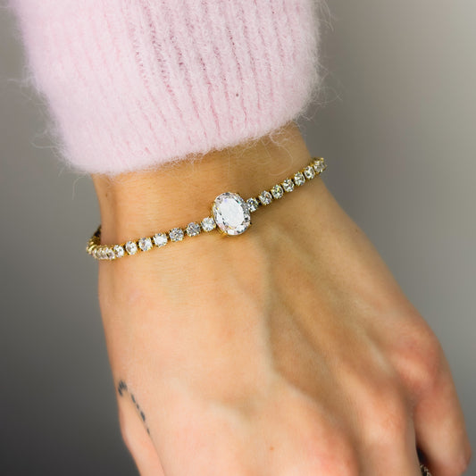 Auksuota apyrankė Tennis su ovaliu baltu cirkoniu